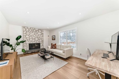 9611 Palisan Place Sw, Calgary, AB - Indoor Photo Showing Living Room With Fireplace