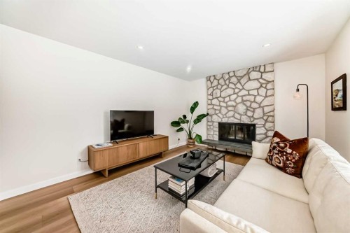 9611 Palisan Place Sw, Calgary, AB - Indoor Photo Showing Living Room With Fireplace