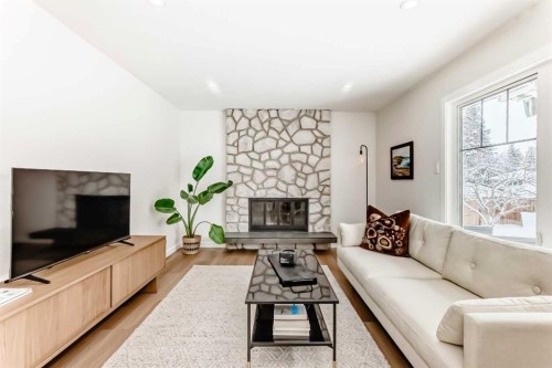 9611 Palisan Place Sw, Calgary, AB - Indoor Photo Showing Living Room With Fireplace