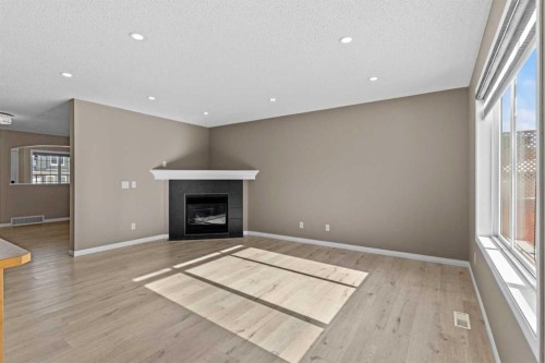 138 Saddlecrest Park Ne, Calgary, AB - Indoor Photo Showing Living Room With Fireplace