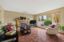 120 Simcoe Close Sw, Calgary, AB  - Indoor Photo Showing Living Room With Fireplace 