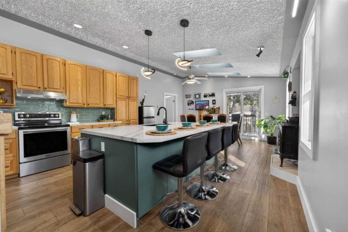 64 Foxwell Road Se, Calgary, AB - Indoor Photo Showing Kitchen With Stainless Steel Kitchen With Upgraded Kitchen