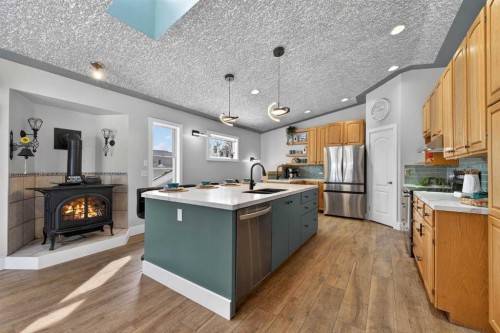 64 Foxwell Road Se, Calgary, AB - Indoor Photo Showing Kitchen With Stainless Steel Kitchen