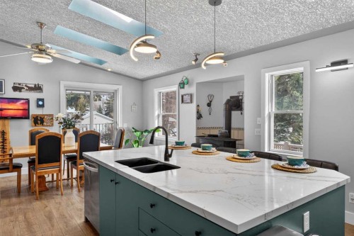 64 Foxwell Road Se, Calgary, AB - Indoor Photo Showing Kitchen With Double Sink