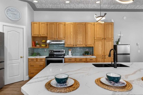 64 Foxwell Road Se, Calgary, AB - Indoor Photo Showing Kitchen With Stainless Steel Kitchen