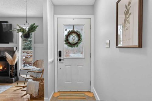 64 Foxwell Road Se, Calgary, AB - Indoor Photo Showing Other Room With Fireplace