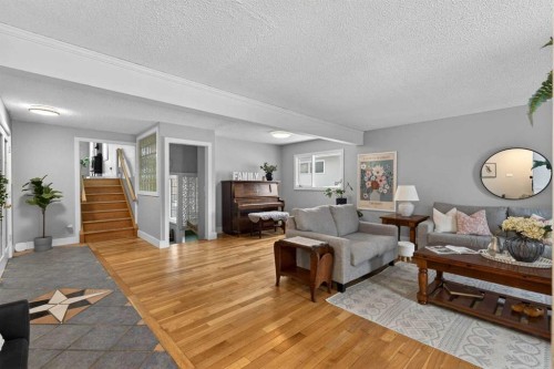 64 Foxwell Road Se, Calgary, AB - Indoor Photo Showing Living Room