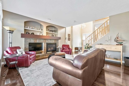 356 Everstone Drive Sw, Calgary, AB - Indoor Photo Showing Living Room With Fireplace