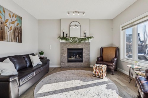 259 Canals Close Sw, Airdrie, AB - Indoor Photo Showing Living Room With Fireplace