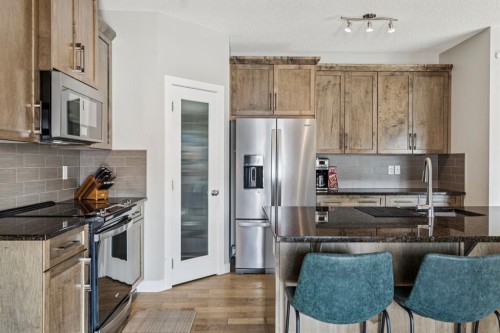 259 Canals Close Sw, Airdrie, AB - Indoor Photo Showing Kitchen With Upgraded Kitchen