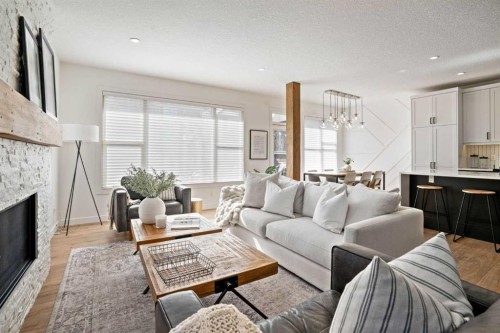 119 Riviera View, Cochrane, AB - Indoor Photo Showing Living Room With Fireplace