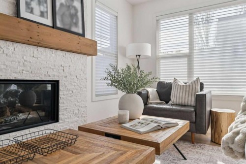 119 Riviera View, Cochrane, AB - Indoor Photo Showing Living Room With Fireplace