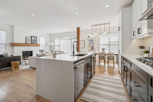 119 Riviera View, Cochrane, AB - Indoor Photo Showing Kitchen With Stainless Steel Kitchen With Upgraded Kitchen