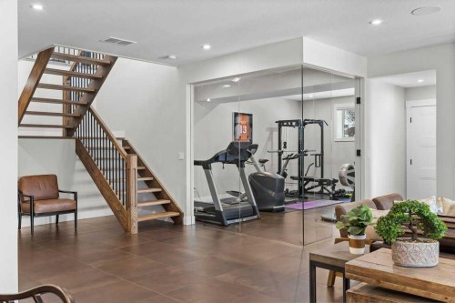 137 Silvertip Ridge, Canmore, AB - Indoor Photo Showing Gym Room