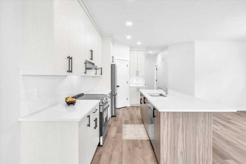 1014 Limit Avenue, Crossfield, AB - Indoor Photo Showing Kitchen With Upgraded Kitchen