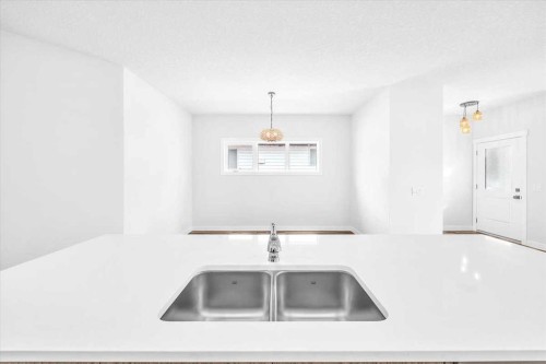1014 Limit Avenue, Crossfield, AB - Indoor Photo Showing Kitchen With Double Sink