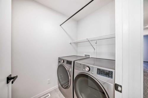 120 Seton Villas Se, Calgary, AB - Indoor Photo Showing Laundry Room