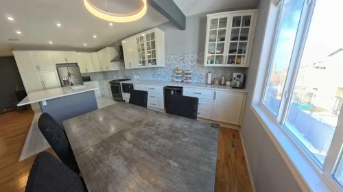 466 Cimarron Boulevard, Okotoks, AB - Indoor Photo Showing Kitchen With Upgraded Kitchen