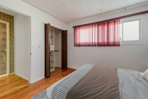 55 Queen Isabella Close Se, Calgary, AB - Indoor Photo Showing Bedroom