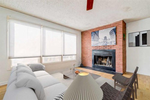 55 Queen Isabella Close Se, Calgary, AB - Indoor Photo Showing Living Room With Fireplace