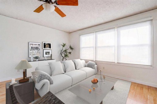 55 Queen Isabella Close Se, Calgary, AB - Indoor Photo Showing Living Room