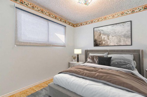 55 Queen Isabella Close Se, Calgary, AB - Indoor Photo Showing Bedroom