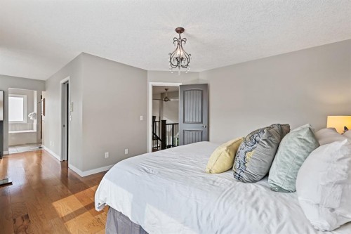 33 Sunset Crescent, Okotoks, AB - Indoor Photo Showing Bedroom