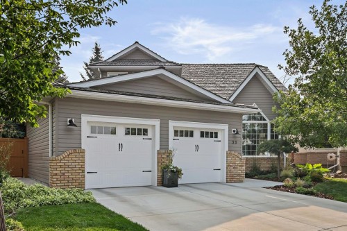 33 Sunset Crescent, Okotoks, AB - Outdoor With Facade