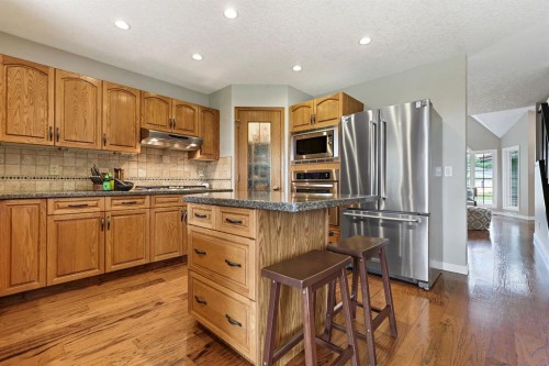 33 Sunset Crescent, Okotoks, AB - Indoor Photo Showing Kitchen With Stainless Steel Kitchen