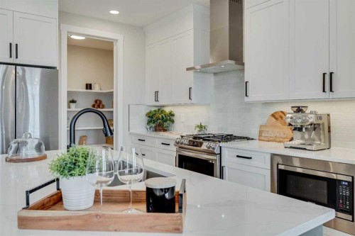 467 Kinniburgh Loop, Chestermere, AB - Indoor Photo Showing Kitchen With Stainless Steel Kitchen With Upgraded Kitchen
