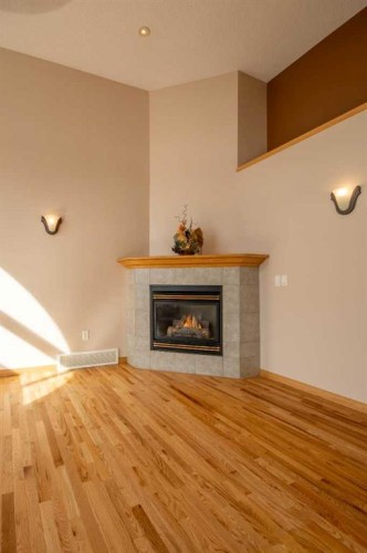 5111 Shannon Drive, Olds, AB - Indoor Photo Showing Living Room With Fireplace