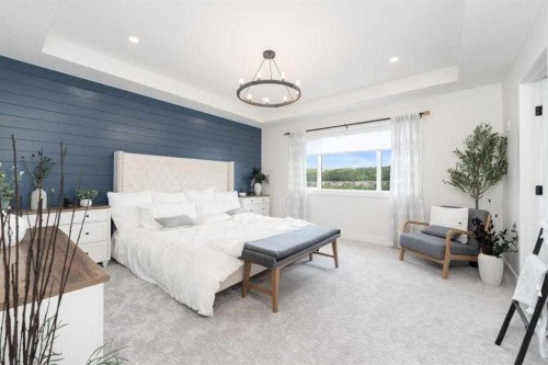 524 Waterford Grove, Chestermere, AB - Indoor Photo Showing Bedroom