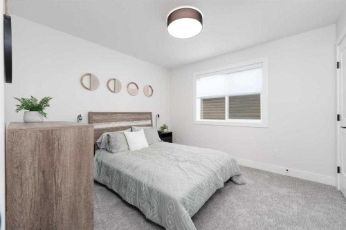 524 Waterford Grove, Chestermere, AB - Indoor Photo Showing Bedroom