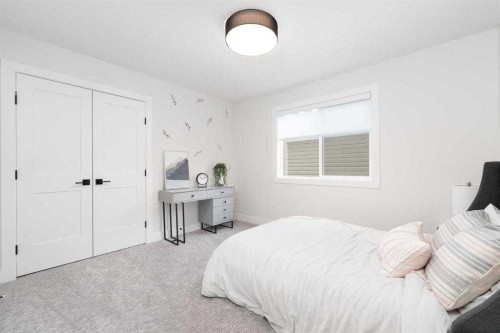 524 Waterford Grove, Chestermere, AB - Indoor Photo Showing Bedroom