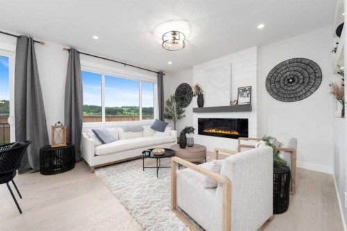 524 Waterford Grove, Chestermere, AB - Indoor Photo Showing Living Room With Fireplace
