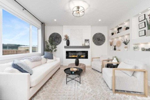 524 Waterford Grove, Chestermere, AB - Indoor Photo Showing Living Room With Fireplace