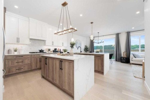 524 Waterford Grove, Chestermere, AB - Indoor Photo Showing Kitchen With Upgraded Kitchen