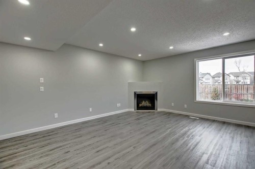 156 Copperfield Rise Se, Calgary, AB - Indoor With Fireplace