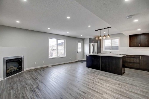 156 Copperfield Rise Se, Calgary, AB - Indoor Photo Showing Other Room With Fireplace