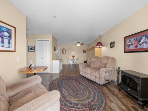 3208 Millrise Point Sw, Calgary, AB - Indoor Photo Showing Living Room With Fireplace
