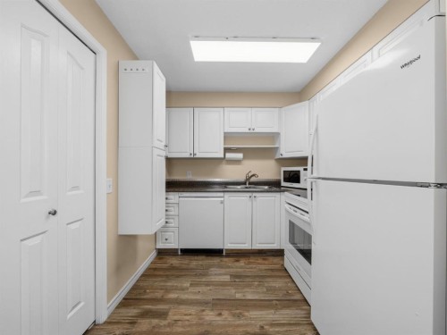 3208 Millrise Point Sw, Calgary, AB - Indoor Photo Showing Kitchen With Double Sink