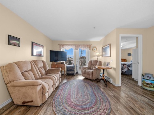 3208 Millrise Point Sw, Calgary, AB - Indoor Photo Showing Living Room