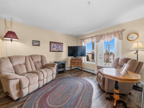 3208 Millrise Point Sw, Calgary, AB - Indoor Photo Showing Living Room
