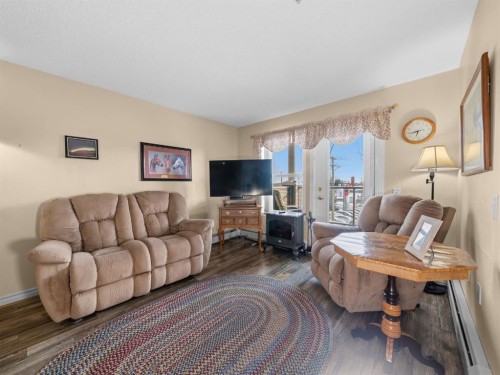 3208 Millrise Point Sw, Calgary, AB - Indoor Photo Showing Living Room