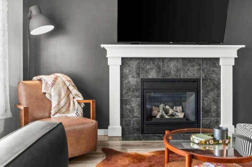 218 Coville Circle Ne, Calgary, AB - Indoor Photo Showing Living Room With Fireplace