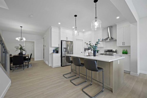 15 Fireside Common, Cochrane, AB - Indoor Photo Showing Kitchen With Stainless Steel Kitchen With Upgraded Kitchen