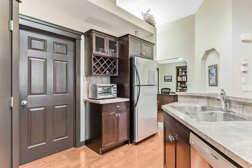 263 Willow Ridge Manor Sw, Diamond Valley, AB - Indoor Photo Showing Kitchen With Double Sink