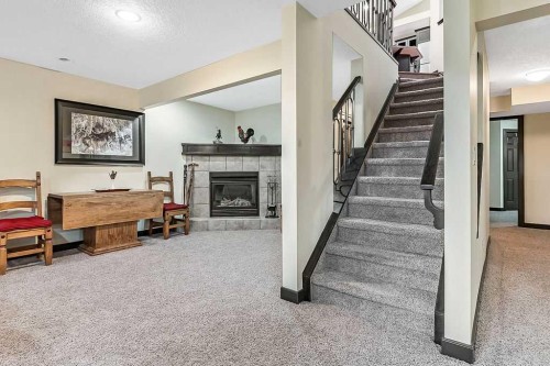 263 Willow Ridge Manor Sw, Diamond Valley, AB - Indoor With Fireplace
