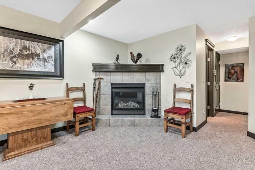 263 Willow Ridge Manor Sw, Diamond Valley, AB - Indoor With Fireplace