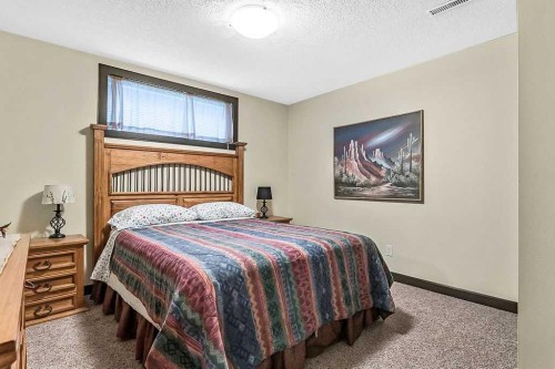 263 Willow Ridge Manor Sw, Diamond Valley, AB - Indoor Photo Showing Bedroom